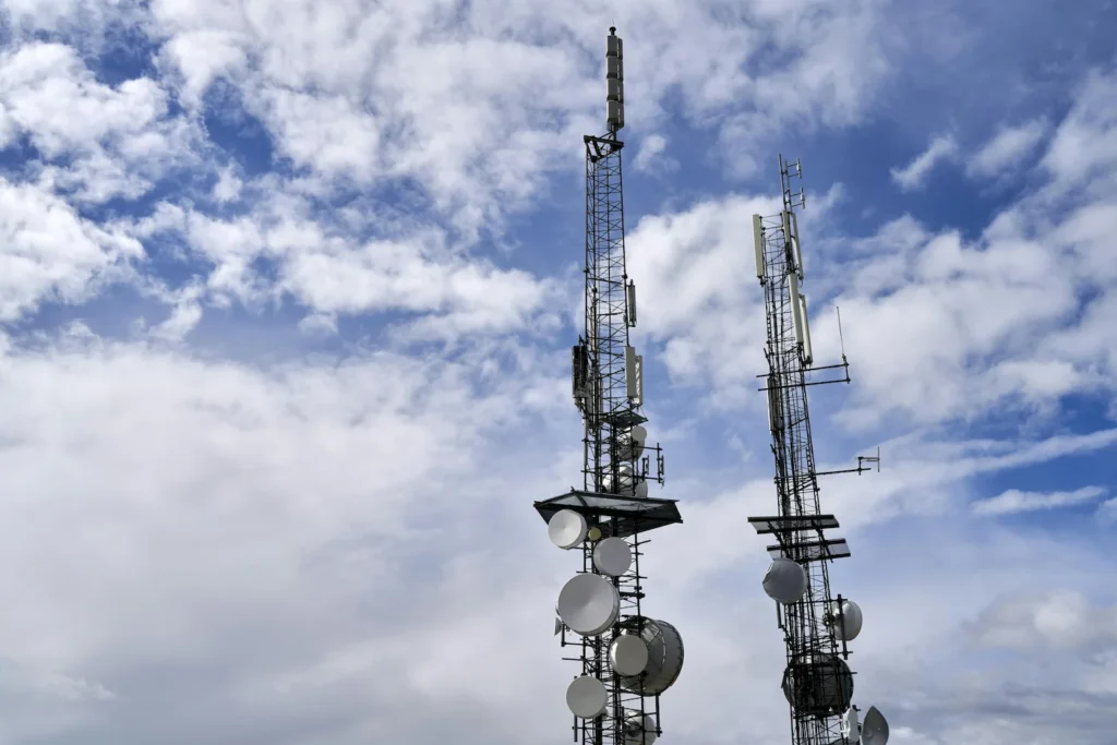 Telecom masts assessed for aviation obstacle safety near an airport.
