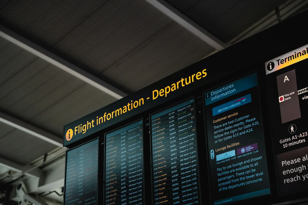 Airport departure boards representing flight procedure design and training.